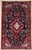 Hand-knotted rug from the Nahavand area of western Iran, featuring a large, elongated central medallion set within a deep...