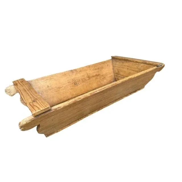 An early 1900s European wood dough bowl with carrying handles — a catchall for kindling, books, and other decor; beautiful...