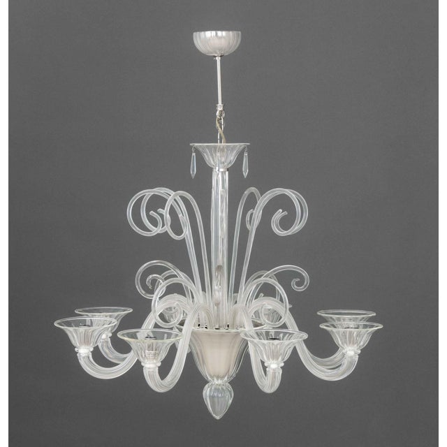 Modern Murano Modern Glass Eight-Branch Chandelier, clear glass around chrome frame, eight scrolling arms surmounted by...
