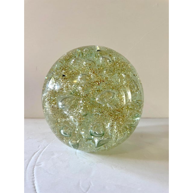 Large vintage art glass sphere with gold glitter and controlled bubbles within. This is bigger than a paperweight. It is...