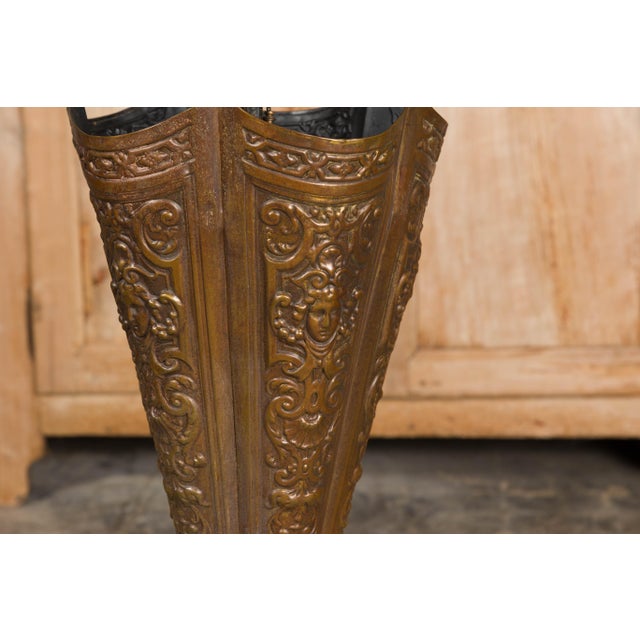 English 1920-1930 Brass Umbrella Stand with Raised Motifs and Tripartite Base For Sale - Image 10 of 11
