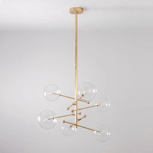 Rd15 6 arms chandelier by schwung dimensions: w 138 x d 138 x h 165 materials: solid brass, hand blown glass globes...