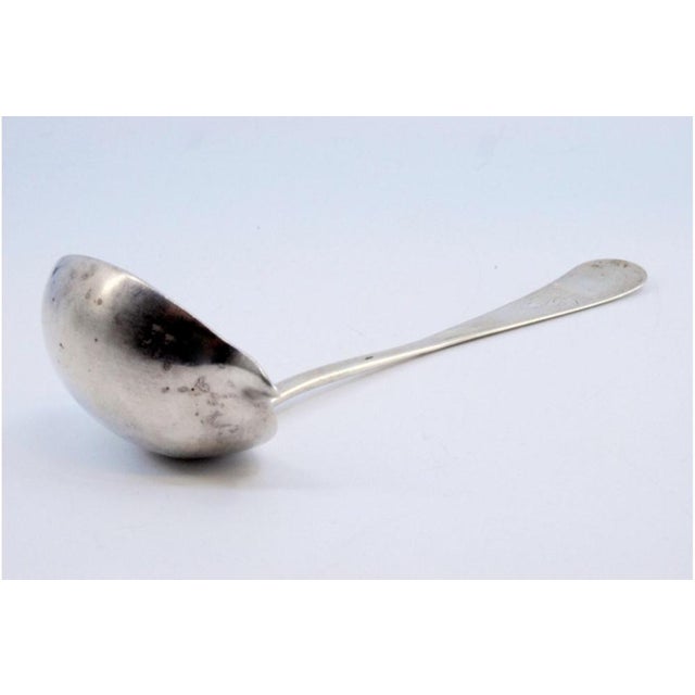 Guilloche Silver Sauce Spoon with Monogram Card, in Very Good conditions. Designed from 2000 This piece has an attribution...