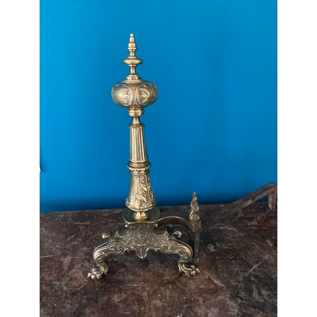 A handsome pair of Continental cast bronze and iron chenets (andirons), dating to circa 1900–1920. Each andiron is crafted...
