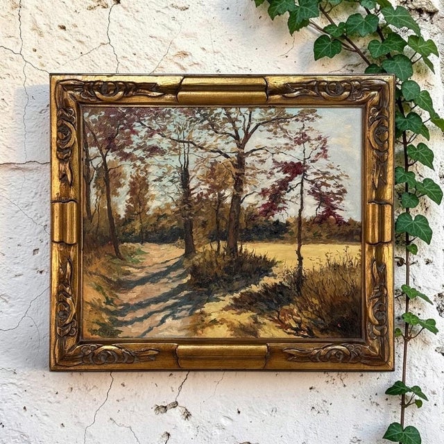 Pierre Colson transforms a quiet woodland path into a study of light, shadow and atmosphere in this signed Belgian oil on...