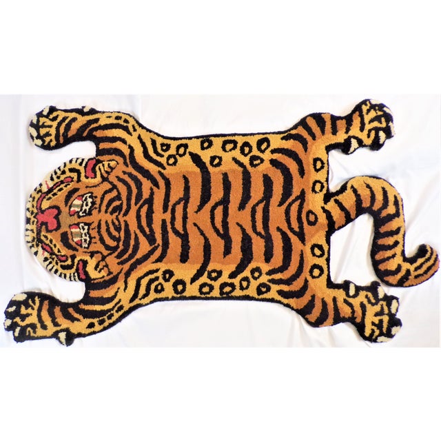 This is a whimsical rug in the shape of Tibetan Tiger. It is called a Persian hunting rug and they are often done with...