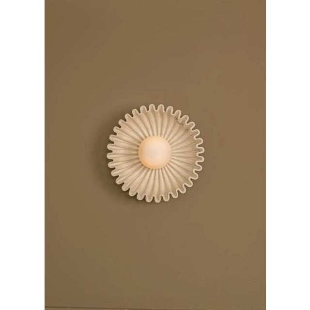 Ostro ecru ceramic wall sconce by simone & marcel dimensions: d 17 x w 31 x h 31 cm. Materials: ceramic and glass. up to...
