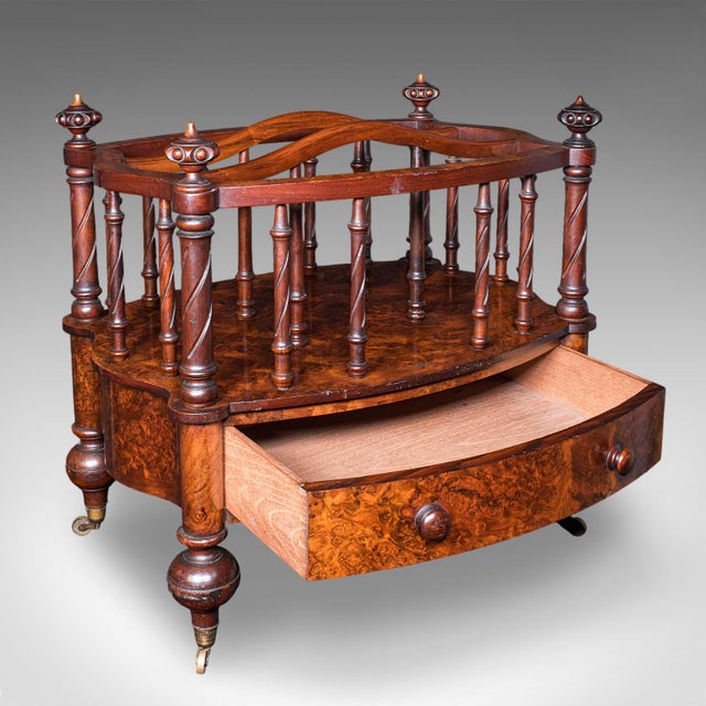 This is an antique Canterbury stand. An English, burr walnut three sectioned magazine or newspaper rack, dating to the...