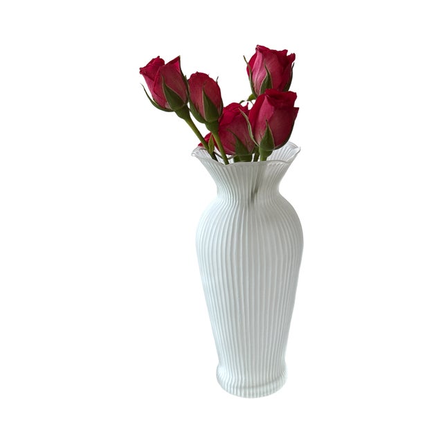 A beautifully proportioned vintage satin glass vase with a softly flared ruffled rim and vertical ribbed optic texture....