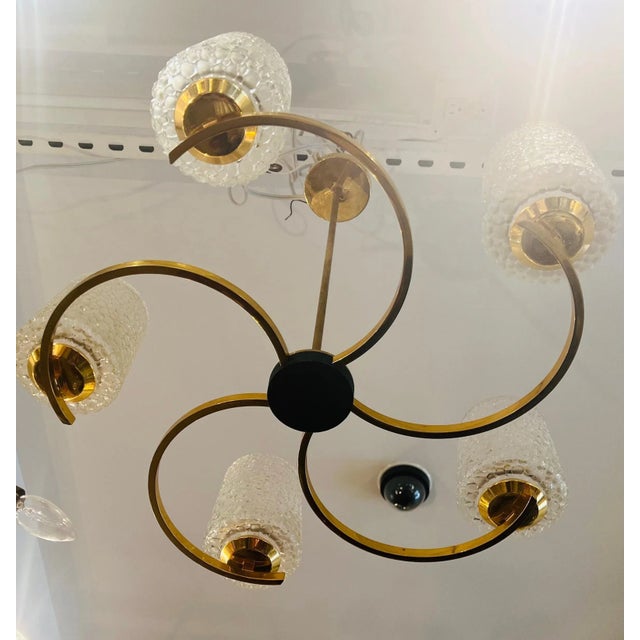 A wonderful 5 light serpentine circular golden brass French chandelier with blown frosted bubble glass shades by French...