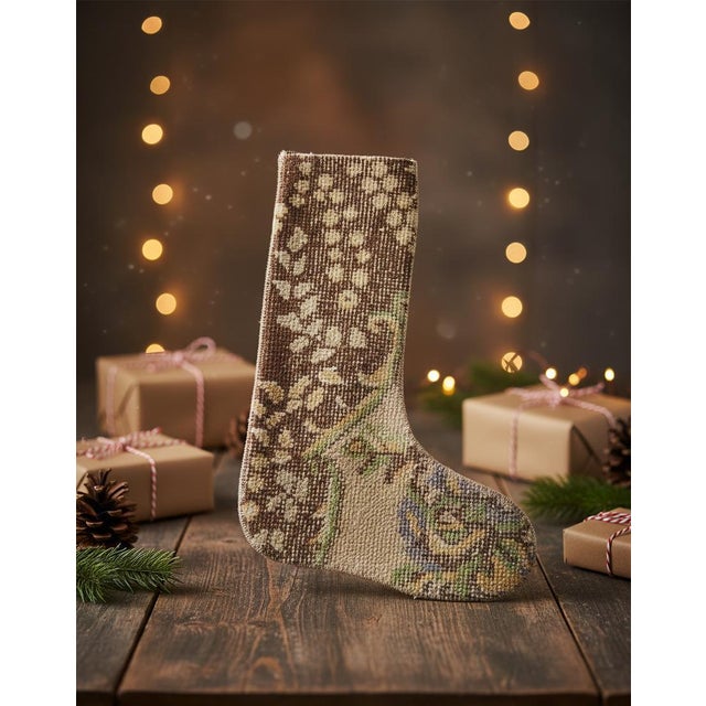 This vintage wool kilim stocking opens with a bold chocolate brown and cream zigzag pattern at the cuff, transitioning...