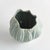 This artisanmade ceramic vase is a real beauty. The reactive glaze accentuates the natureinspired texture of the piece. A...