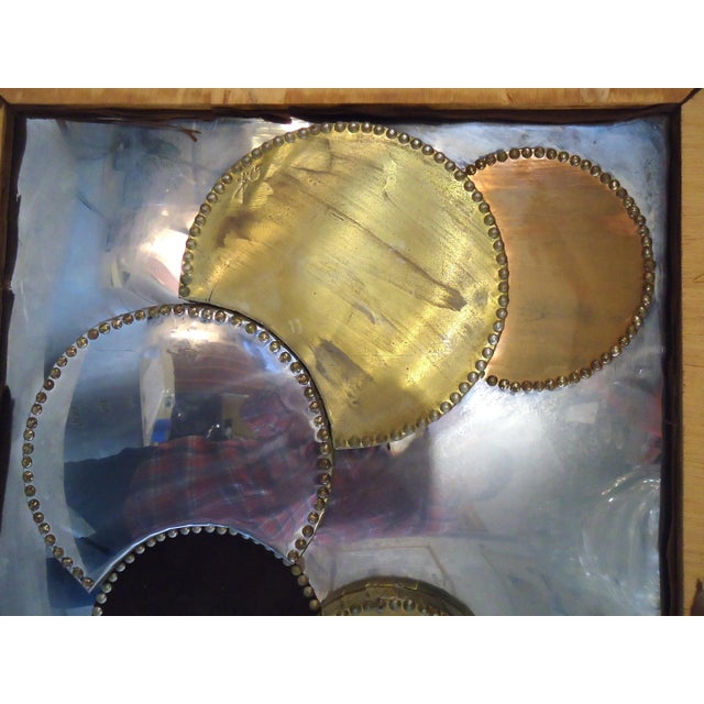 Framed mid-century modern style wall art featuring circular abstract metal figures. Dimensions: H 25 in. x W 49 in. x D 2...