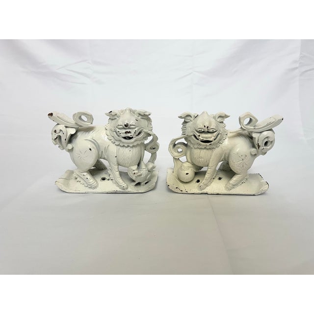 Add a striking dose of symbolism and character to your home with this vintage pair of Chinese wooden Foo Dogs, beautifully...