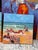 In Time Out I and Time Out II, Godfrey Afebuame paints simple, bright scenes of people relaxing at the beach. Using thick...