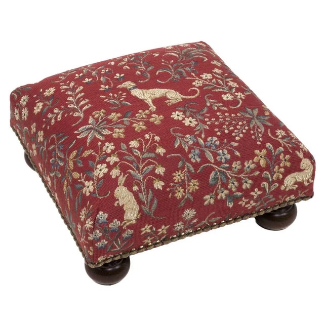 Tapestry Footstools with bun-feet and traditional-style studding.