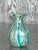 Bring timeless elegance to your home with this exquisite vintage Mdina glass vase, handcrafted in Italy. This petite...