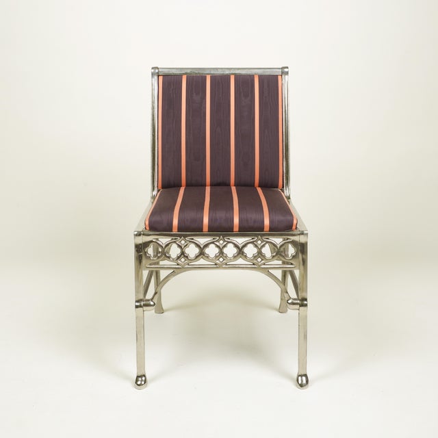 Comprising two armchairs and four side chairs, the fronts are upholstered in Turban moiré in Coffee and the reverse in...