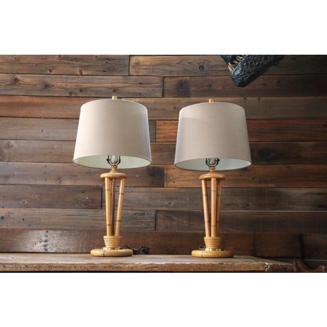 Beautiful pair of 1950s Heywood-Wakefield, ( no maker’s mark). table lamps featuring elegant triple bamboo-form splayed...