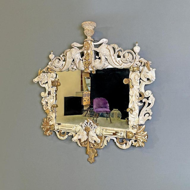 Italian antique white and golden wood wall mirror with animal decorations, 1990s Rectangular wall mirror with finely...