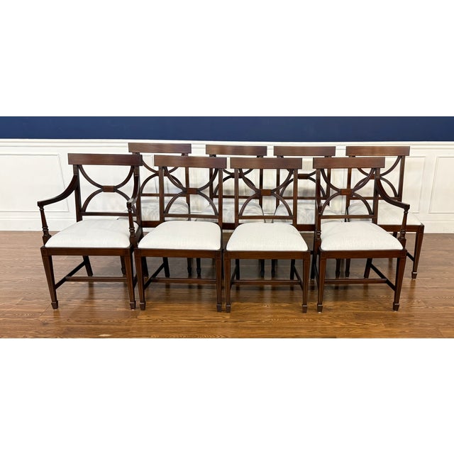 This is a set of eight (2 arms and 6 sides) traditional mahogany Adams style dining chairs by Leighton Hall. Their design...