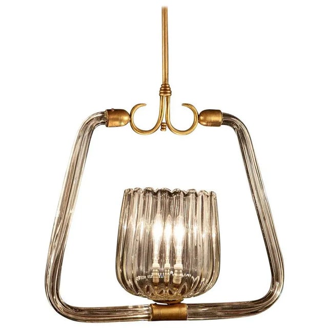 Chandelier with essential design and great elegance attributable to Gio Ponti. Centered by an amazing hand blown cup with...