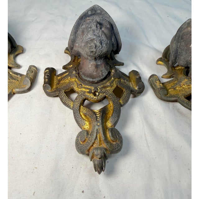 Up for sale is a set of four antique ornate Victorian gilt bronze and white metal salvage hardware appliques. These...