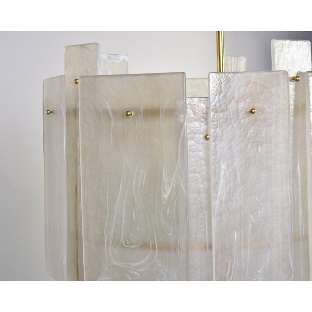 New and found in Italy, this large hanging oval-shaped pendant has five lights. Polished brass hardware includes a...