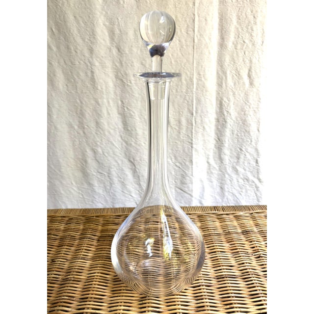 Nothing fussy--just a classic, clean-lined decanter from Baccarat France that will look very comfortable in a mid-century...