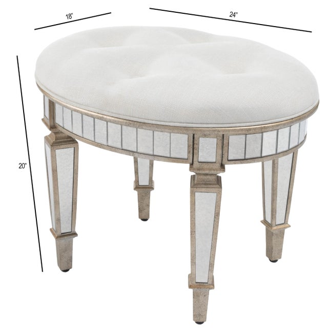 This mirrored vanity stool is crafted of Birch Wood solids and trimmed in antique pewter. The upholstered, tufted seat is...