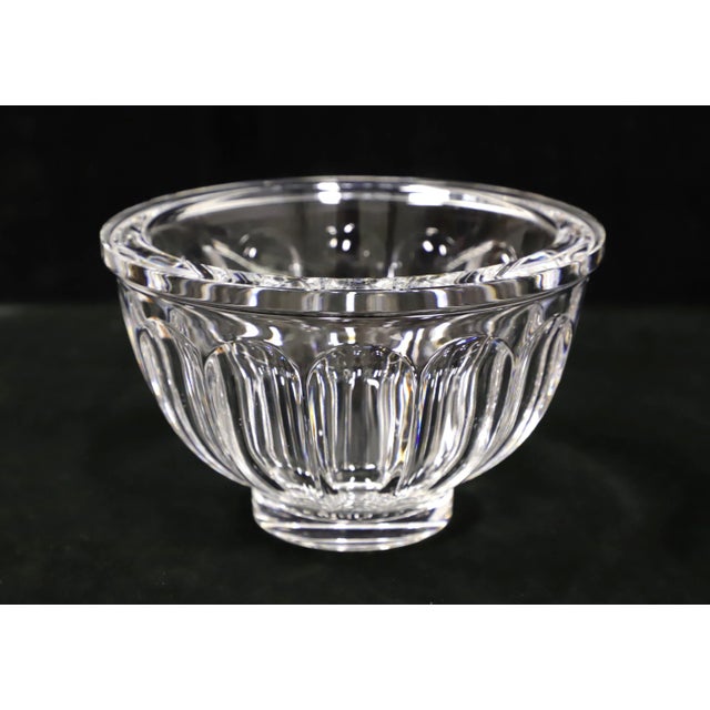 A Late 20th Century decorative crystal bowl. Clear thick crystal round bowl with a narrow solid rim with cut ovals beneath...