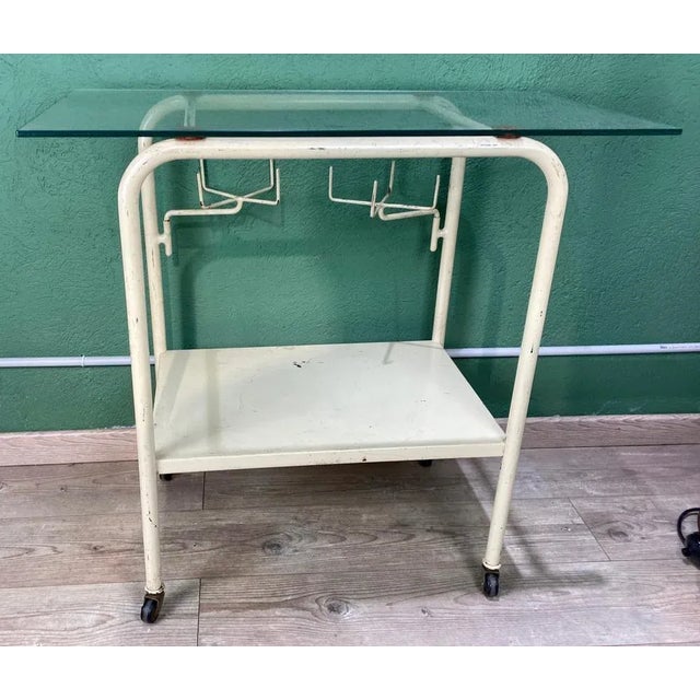 Vintage White Hospital Table, in Good conditions. Designed 1960 to 1969 This piece has an attribution mark, I am sure that...