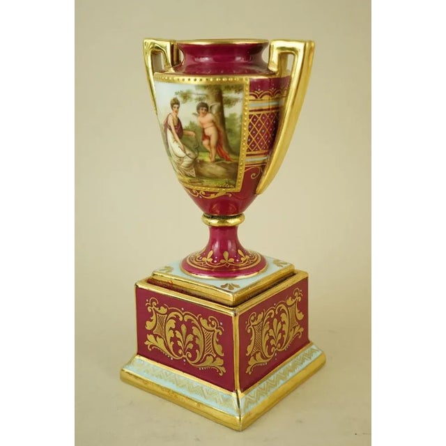 Item description: Two-handled vase in the shape of a Roman amphora, made of fine vitrified hard-paste porcelain, with a...