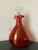 A beautiful hand blown glass liquor or spirits decanter, circa mid-20th century, USA. Decanter is brightly colored in...