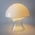 A very elegant, modern mushroom table lamp by Peill & Putzler from the mid-20th century. Made of mouth-blown Murano opal...