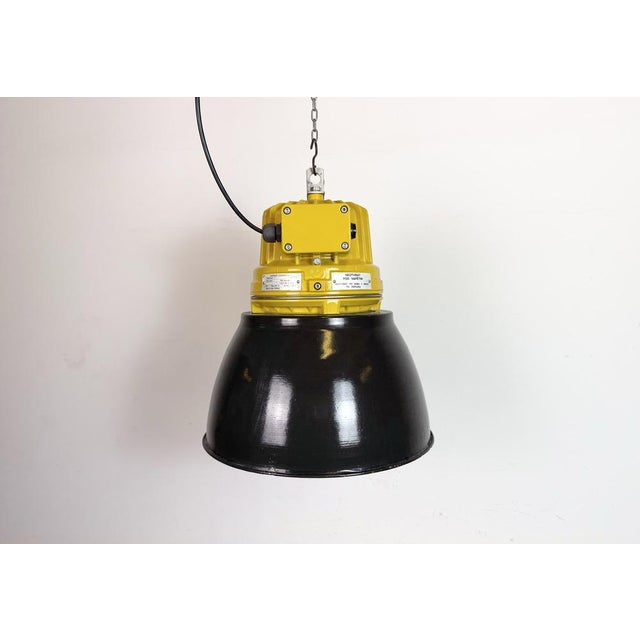 Industrial factory pendant light manufactured by elektrosvit in czech republic during the 1990s. It features a cast...