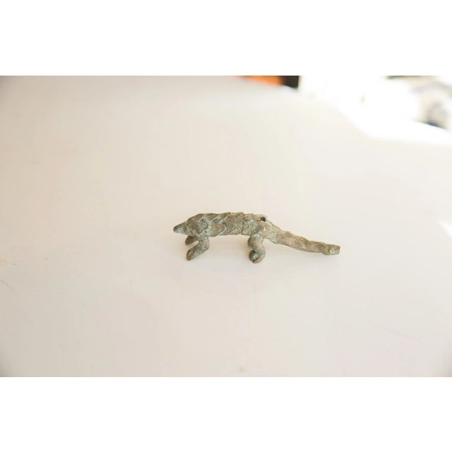 :: Vintage African pangolin sculpture. Kindly note the item photographed may not necessarily be an identical to that which...