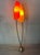 Vintage floor lamp with 2 fiberglass shades in 2 colors. Curved brass arms. Typical pastel-colored base. 2 brass E27...