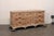A French carved oak buffet cabinet from the 19th century. This antique console cabinet from France features abundant...