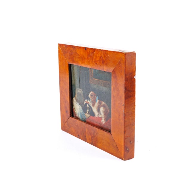 A charming small copy of Sir Edwin Landseer's beloved 1845 composition "The Cavalier's Pets," depicting two King Charles...