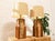 striking vintage table lamp combining warm walnut with a richly textured cork center panel. The tall rectangular body is...