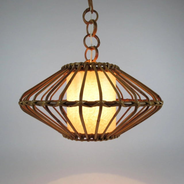 This pendant features a bamboo body and a textured shade that filters the light giving a warm and cozy effect. The high of...