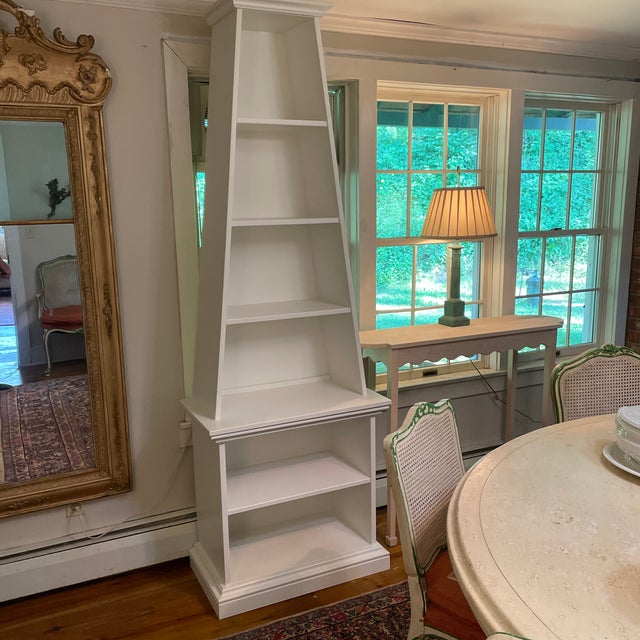 Shown in white dove by Benjamin Moore but available unfinished as well as in custom colors, Irwin & Lane's Obelisk...