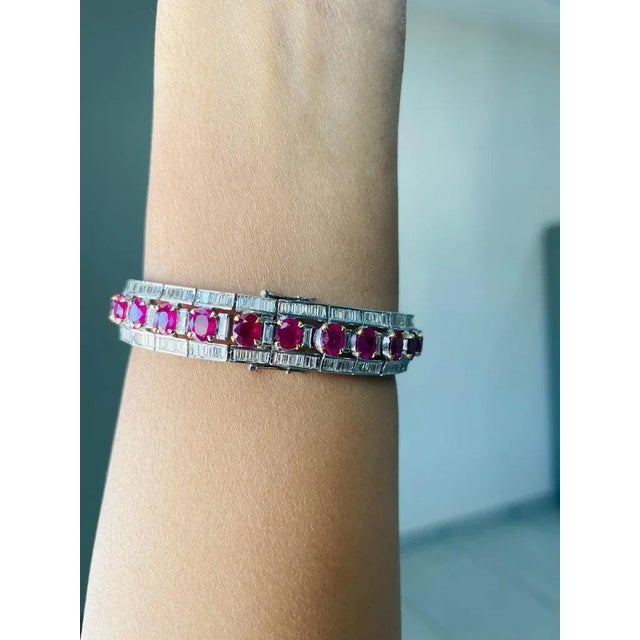This is part of Chairish’s Fine Jewelry assortment. This Diamond Ruby Tennis Bracelet in 18K gold showcases 26 endlessly...