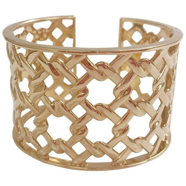 Christina Addison 18kt Yellow Gold Basket Weave Cuff is made with an adjustable hinge to make it easier to take on and...