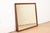 A gorgeous mid-century traditional or Early American style solid mahogany framed wall mirror In the manner of Kindel...