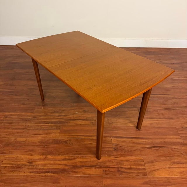 Beautiful vintage rectangular teak dining table by Gordon Russell, made in the U.K. circa 1960's. This piece features nice...