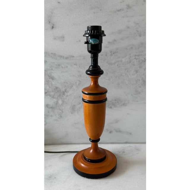 Vintage mid century turned wood table lamp with hand painted black decorative bands. Maple finish and contrasting black...