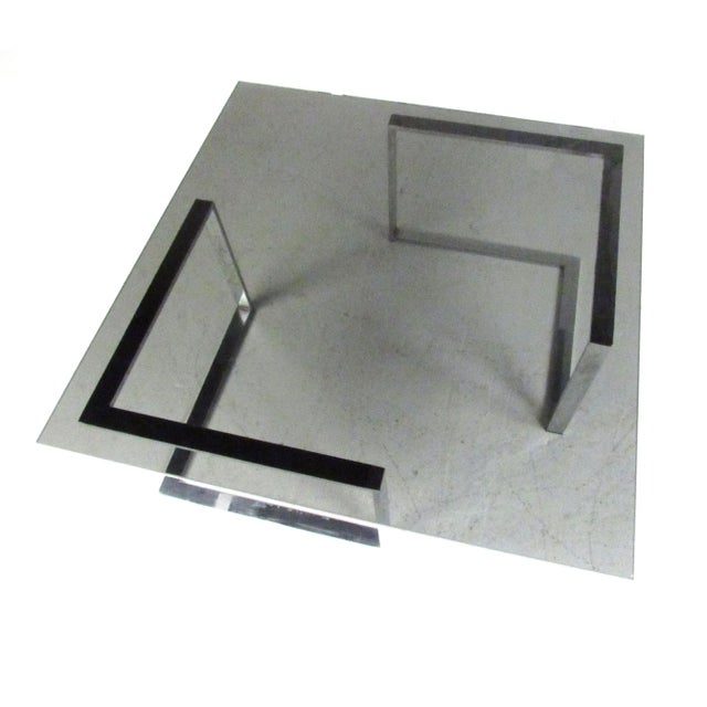 Mid Century Modern style coffee table with two piece chrome base and 12" thick dark grey tinted glass top.