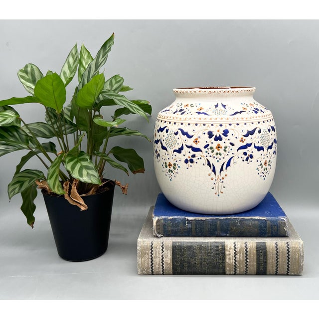 Stunning vintage pottery vessel by Arauco Antiqua of Chile, featuring a beautifully detailed hand-painted floral and...